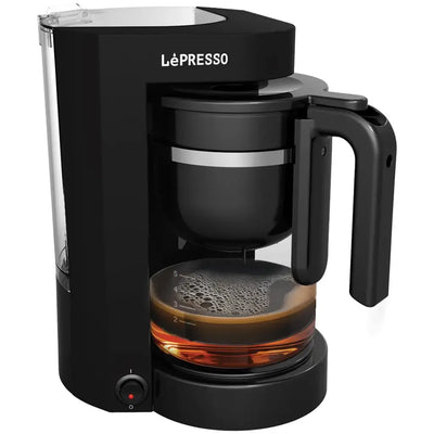 LePresso Duo Brew coffee and tea maker in black, front view showing heat-resistant glass carafe and control panel