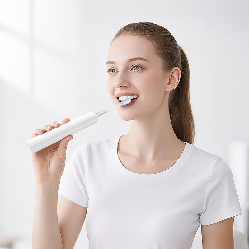 Two brush heads included with HOCO HP64 toothbrush