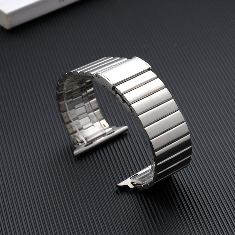 Spigen Modern Fit fold-over metal clasp detail showing secure lock mechanism in silver stainless steel