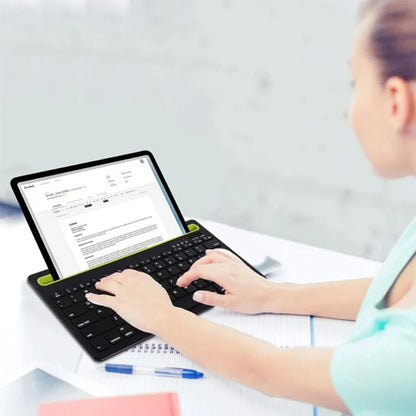 Coteci OF-034 keyboard holding tablet in slot for multitasking.
