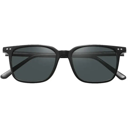 Green Lion sunglasses worn outdoors in sunlight
