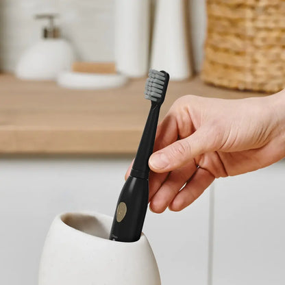 Green Lion toothbrush with replaceable brush heads and sleek design
