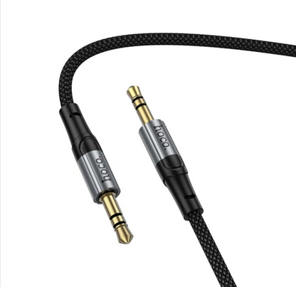 HOCO UPA313 1.5-meter audio cable connecting phone to speaker system.
