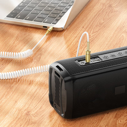 HOCO UPA31 audio cable connecting phone to car stereo system.
