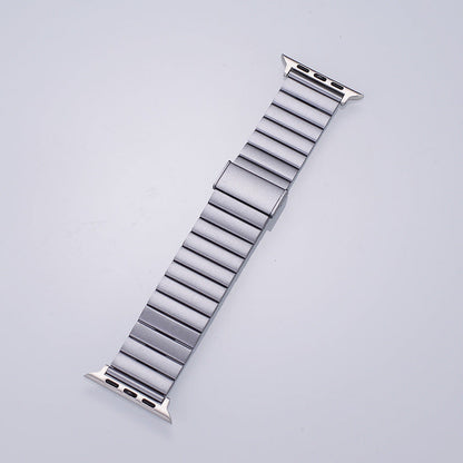 Spigen Modern Fit stainless steel Apple Watch band in silver, full length view showing link bracelet design on light background
